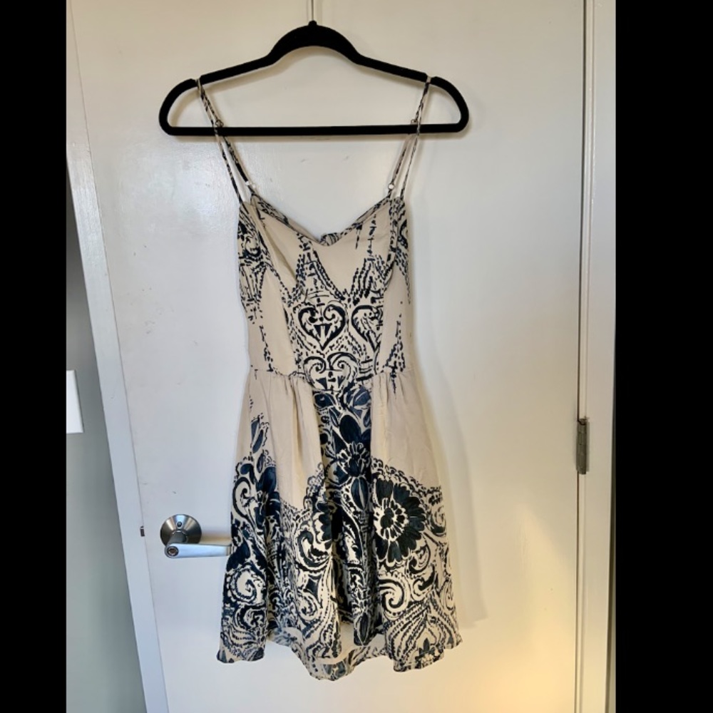 Cream colored sundress with dark blue accents